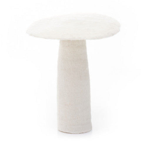 A large white felt mushroom with a flat, round cap and a cylindrical stem, set against a neutral background.