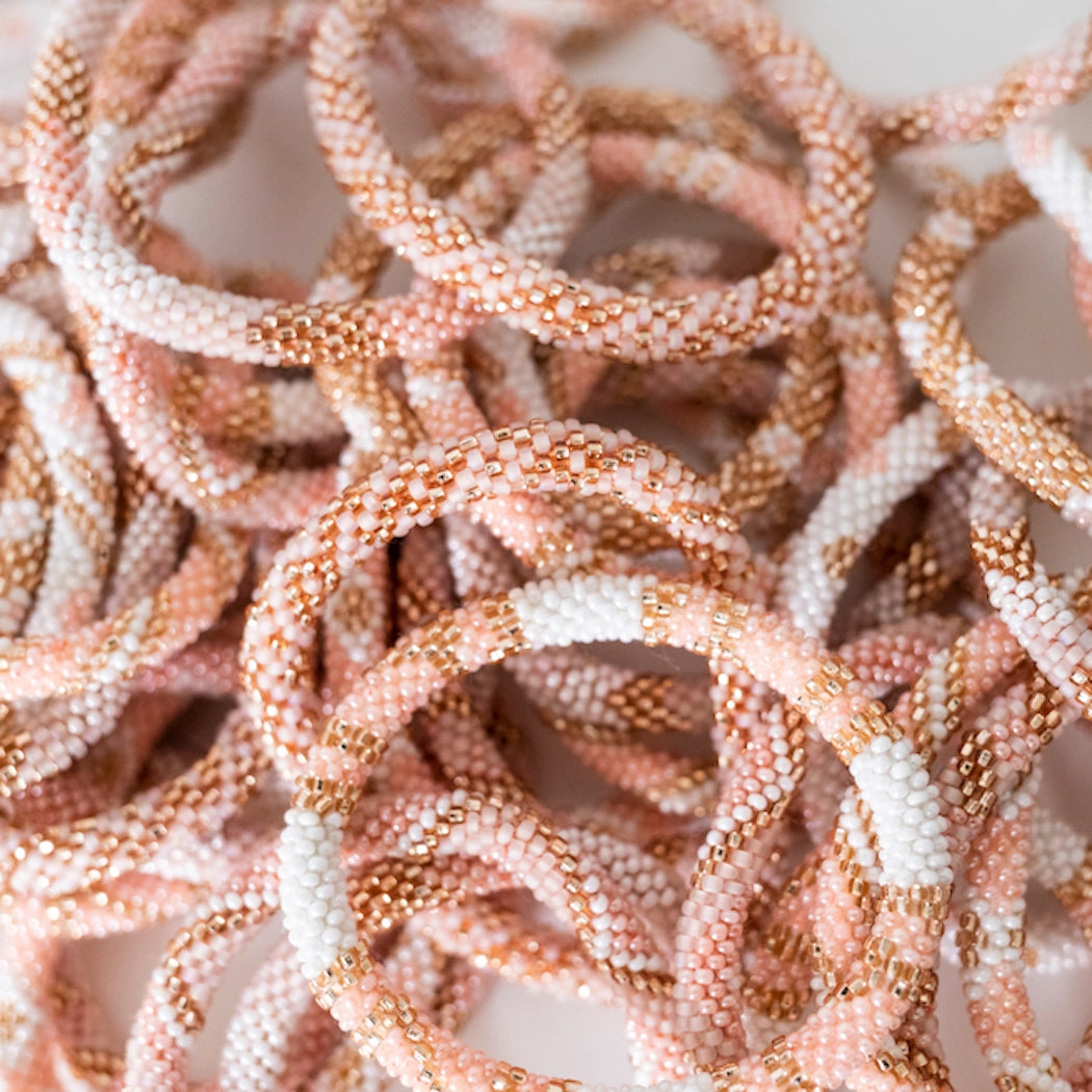 aid through trade | roll on bracelet | blush