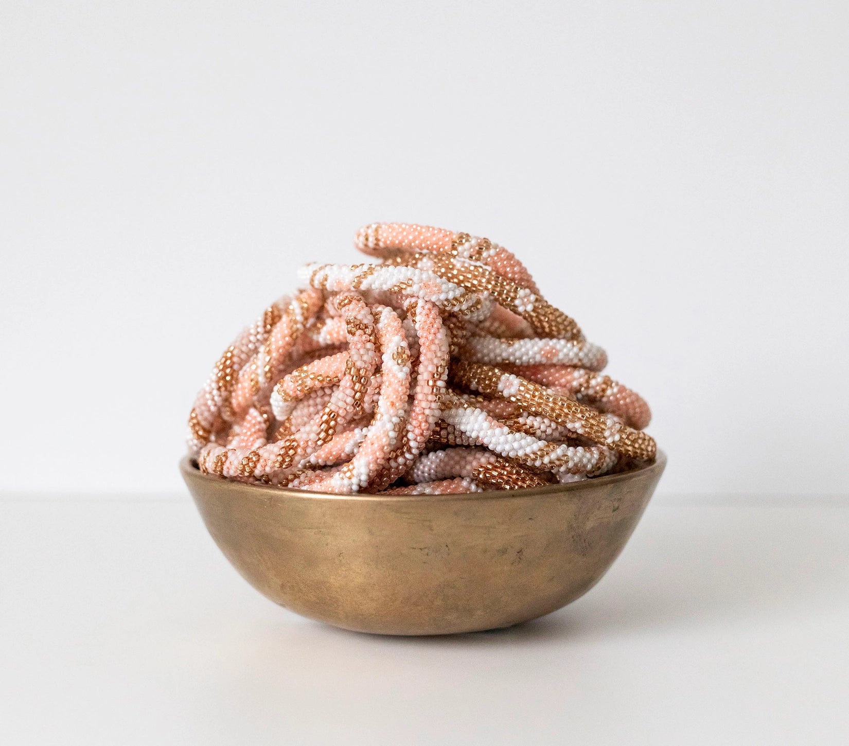 mondocherry - aid through trade | roll on bracelet | blush - bowl