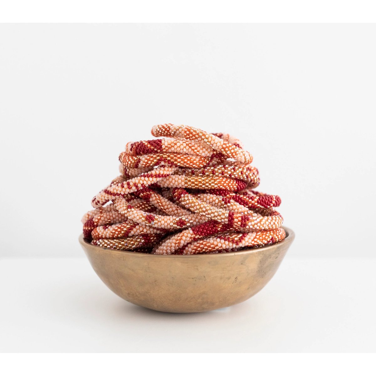 mondocherry - aid through trade | roll on bracelet | rosewood - bowl