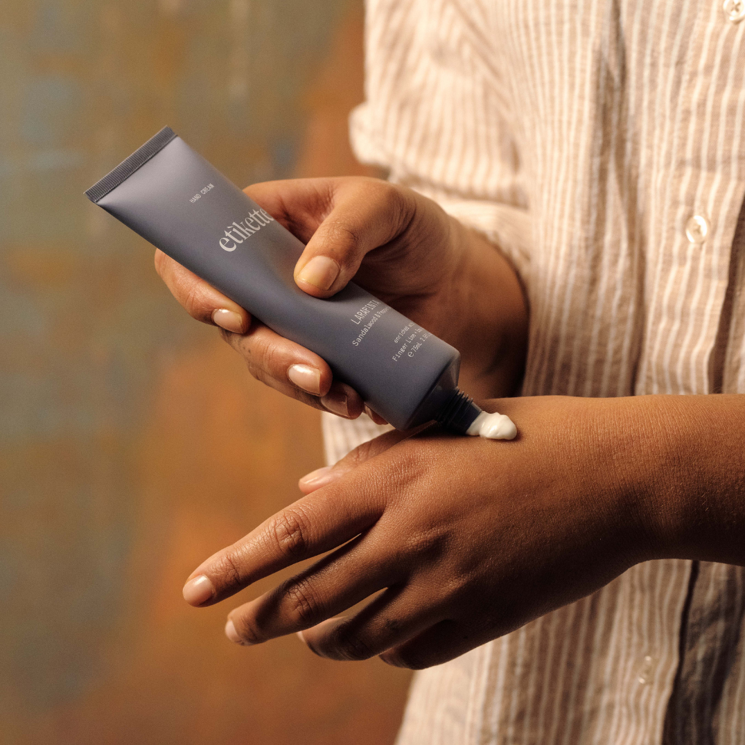 Etikette — hand cream — Larapinta in sandalwood & pepperberry — being applied to hands