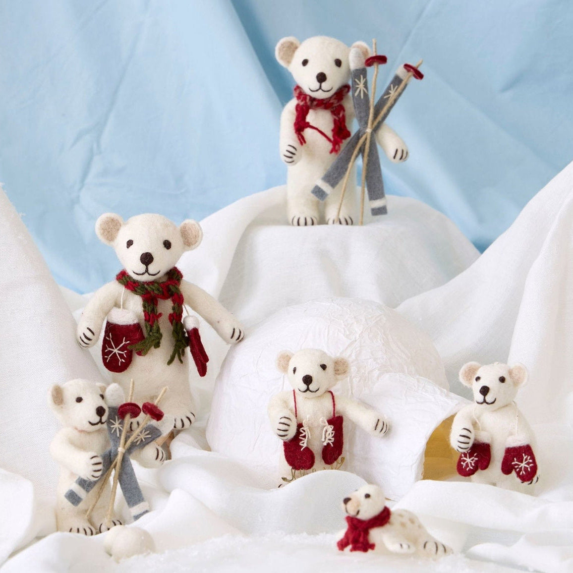 Gry & Sif — polar bear with candy cane — medium — polar bear family arranged on snowy white fabric with skis and red accessories