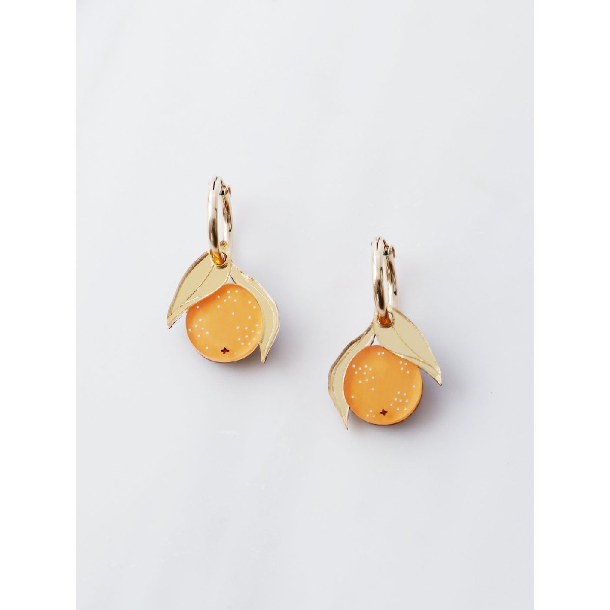 Wolf and Moon | mini orange hoop earrings - front