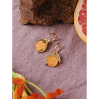 Wolf and Moon | mini orange hoop earrings - table