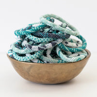mondocherry - aid through trade | roll on bracelet | mint - bowl