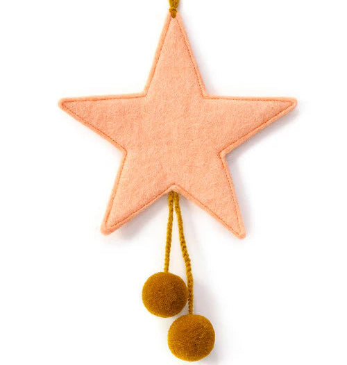 Decorative star with pom-poms on a white background