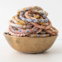 mondocherry - aid through trade | roll on bracelet | glitter - bowl