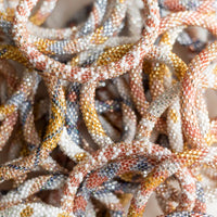 mondocherry - aid through trade | roll on bracelet | glitter - close