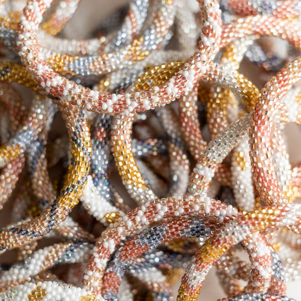 mondocherry - aid through trade | roll on bracelet | glitter - close