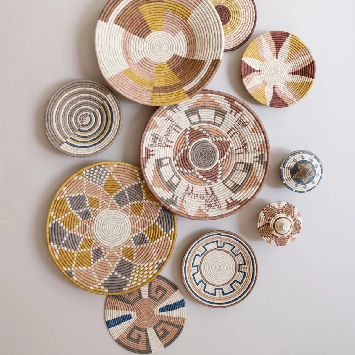 Decorative woven baskets with geometric patterns.