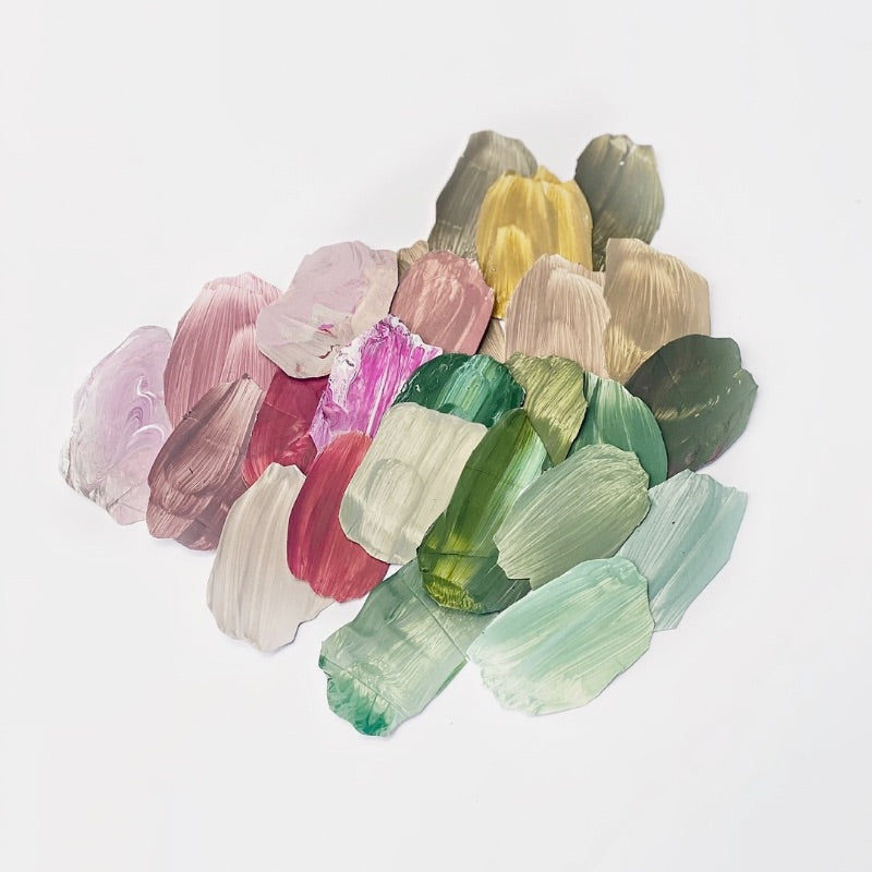Colourful paint swatches on a white background.