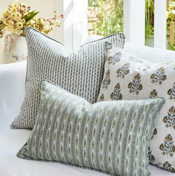 Walter G decorative cushions on a sofa.