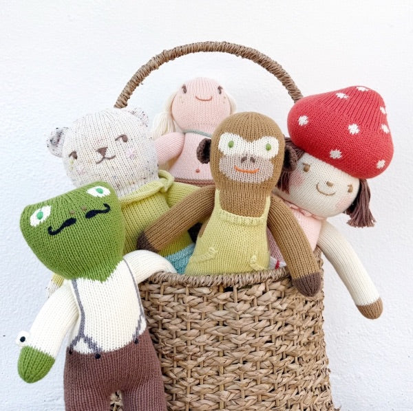 Basket of colourful knitted BlaBla dolls.