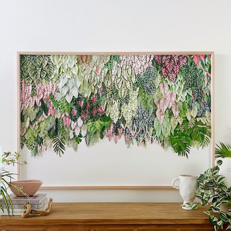 Colourful Mondocherry leaf artwork on a wall.