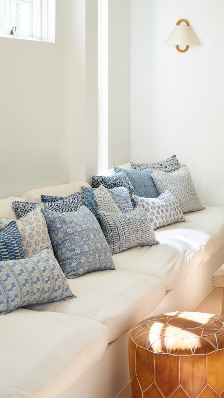 White sofa with blue Walter G patterned cushions.