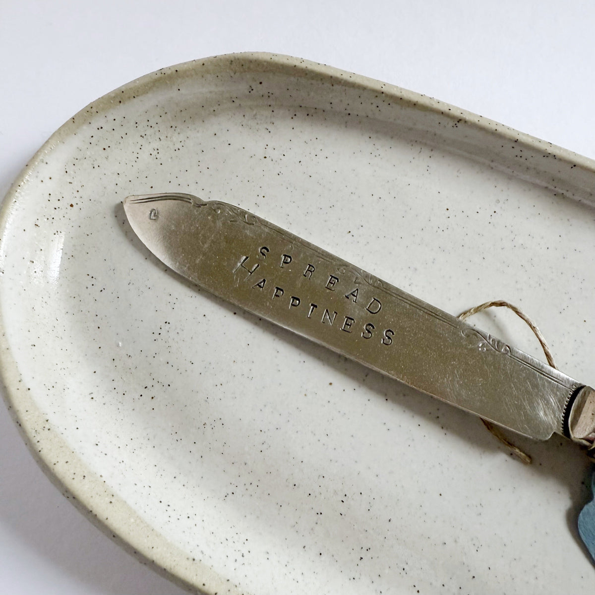mondocherry - antique silverware butter knife | "spread happiness" - close