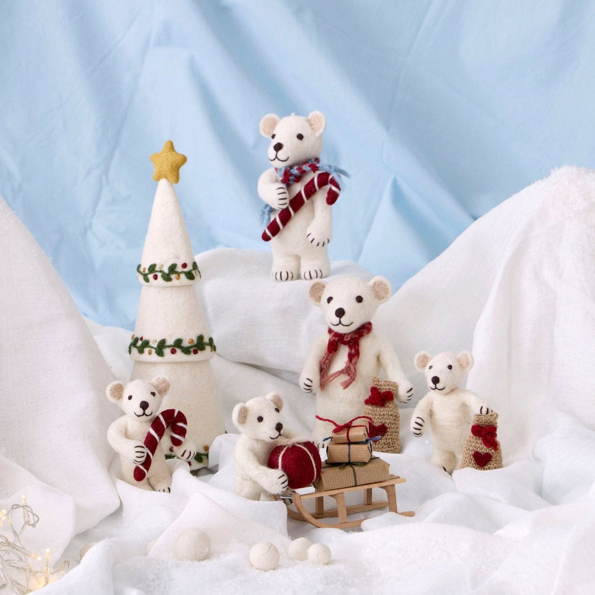 Gry & Sif — polar bear with candy cane — medium — polar bear family displayed with a felt tree on snowy white fabric