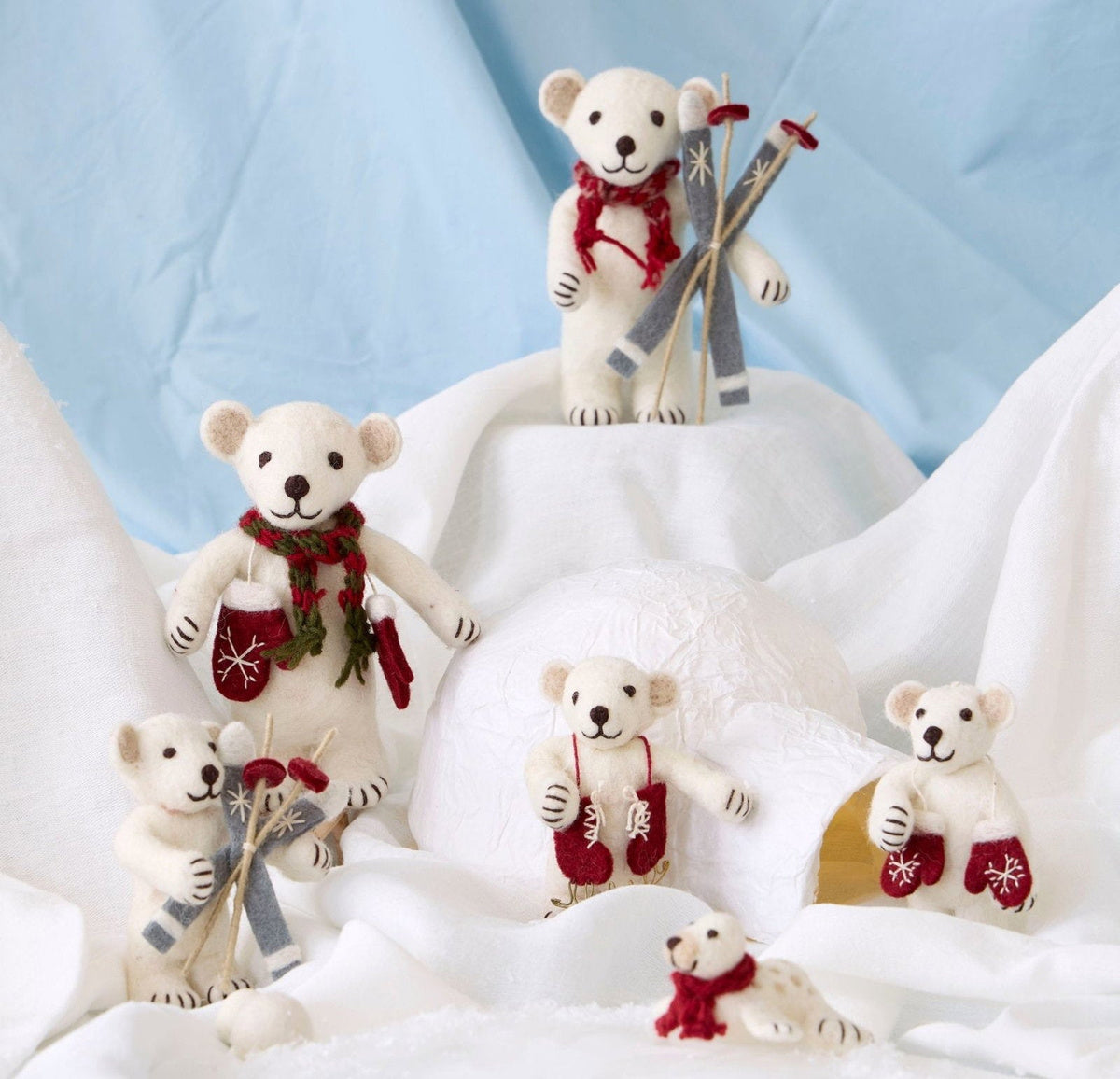 Gry & Sif — polar bear with gift — medium — polar bear family arranged with a felt tree on snowy white fabric
