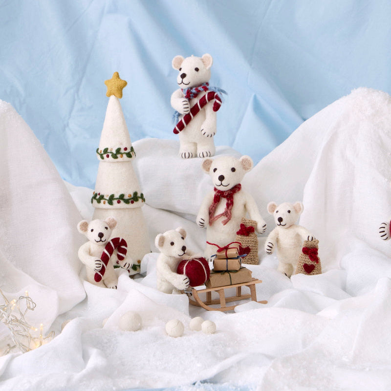 Gry & Sif — polar bear with gift — small — polar bear family arranged with a felt tree on snowy white fabric