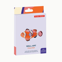 Packaging of Studio Roof wall art clownfish on a white background