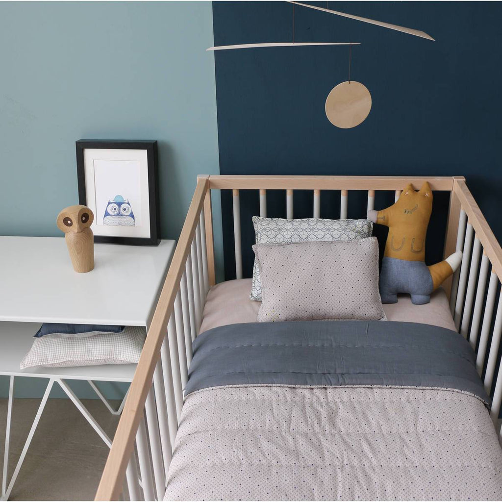Camomile London | foxy kids cushion | ochre and blue - in cot