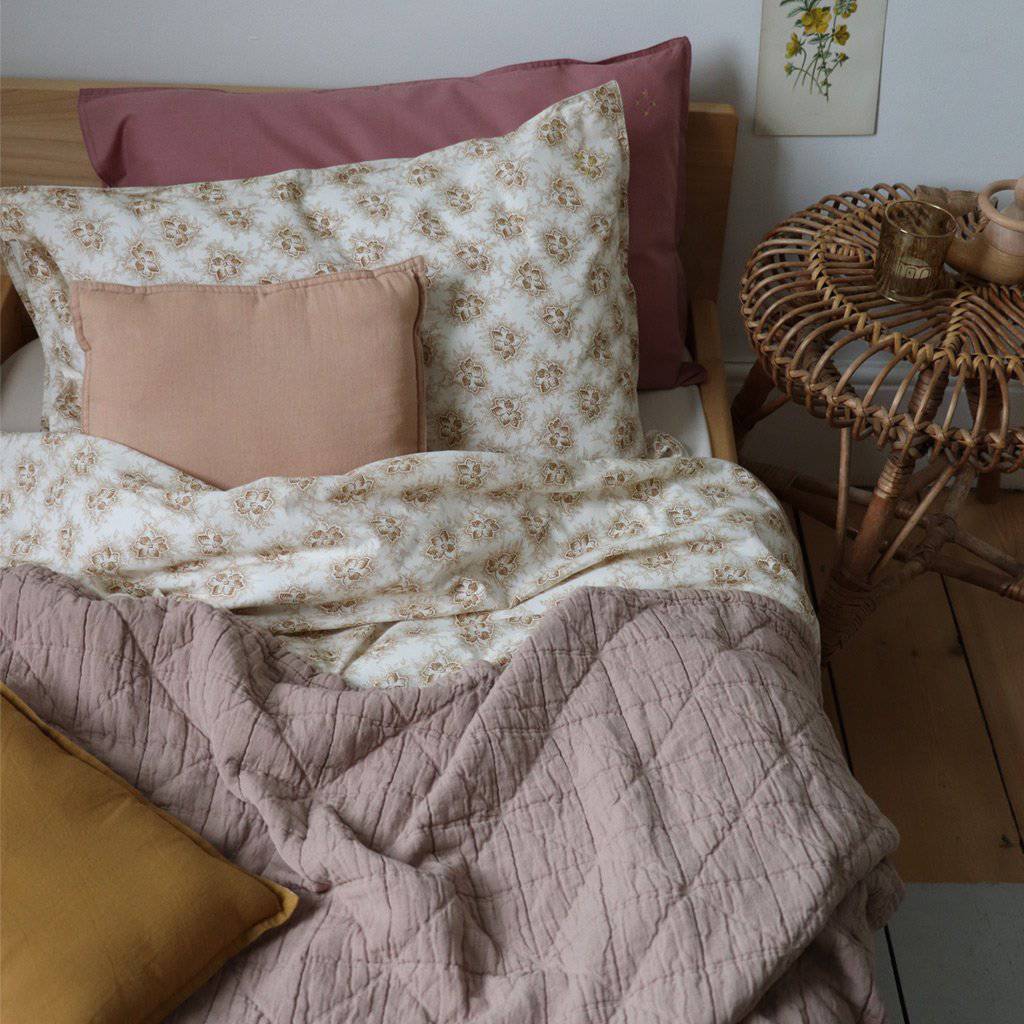 Camomile London | diamond single cotton blanket | mink - on bed