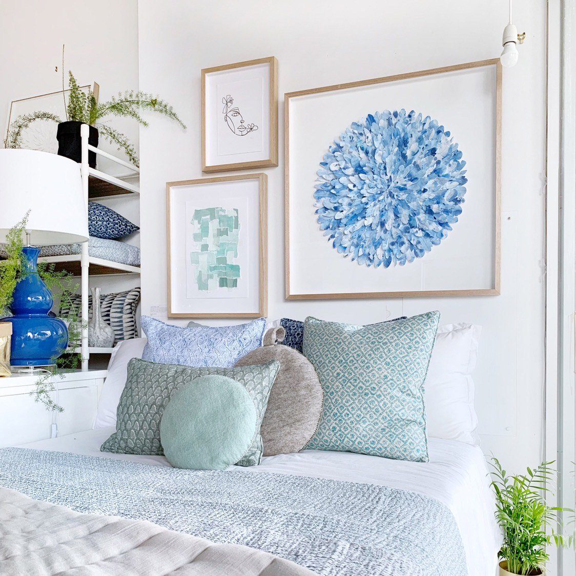 mondocherry mountain bluebird paper feather artwork on wall