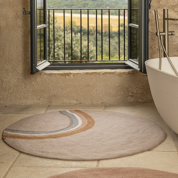 Muskhane indreni rainbow round rug | sand - bathroom