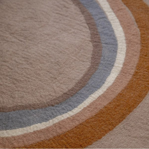 Muskhane indreni rainbow round rug | sand - close