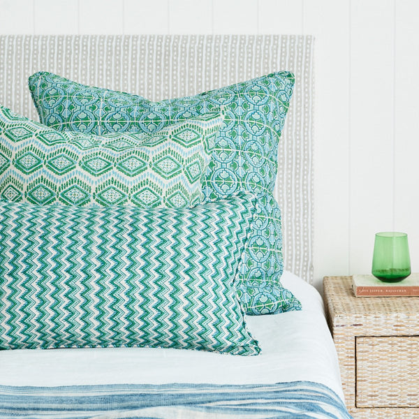 Walter G | ravello linen cushion | emerald - bed