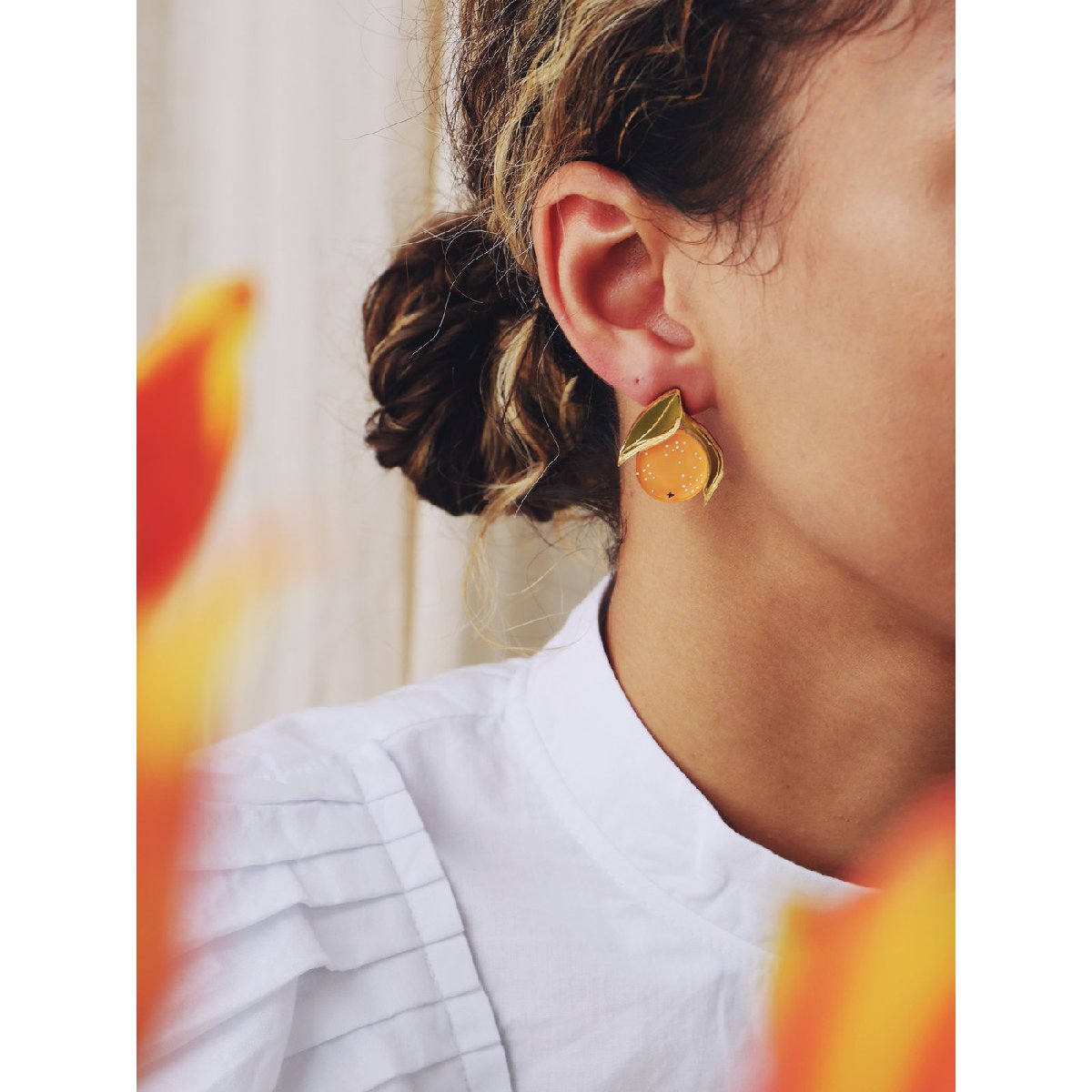 Wolf and Moon | mini orange stud earrings - wear