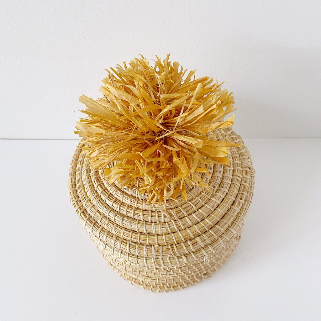 African woven pom pom lidded basket | sunset #1 - top